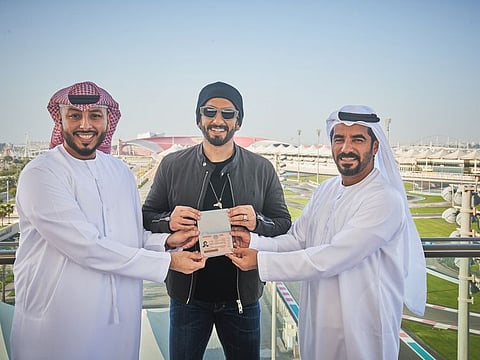 Ranveer Singh getting the UAE Golden Visa in the presence of Mohamed Abdalla Al Zaabi, CEO of Miral (right), and Saleh Al Ahmadi, representative from TwoFour54 (left).