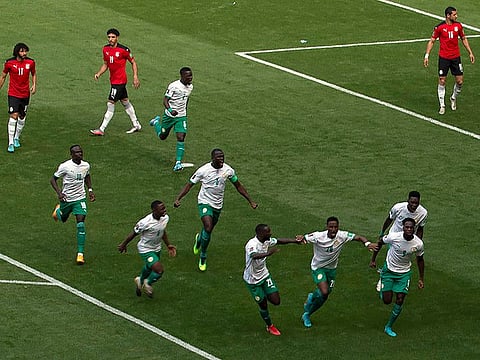 Senegal players celebrate a goal scored by Idrissa Gana Gueye against Egypt.