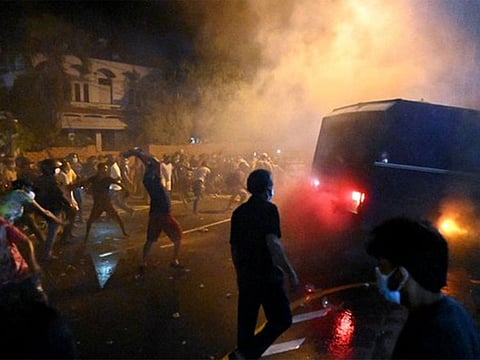 Nearly 50 people were injured and protesters set fire to an army bus and a jeep, the news website said.