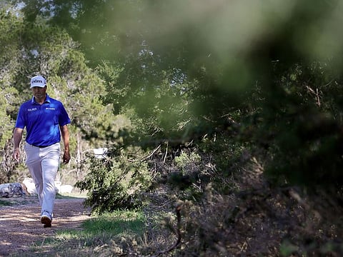 Ryan Palmer walks across the 15th hole during the second round of the Valero Texas Open at TPC San Antonio in San Antonio, Texas on Friday.