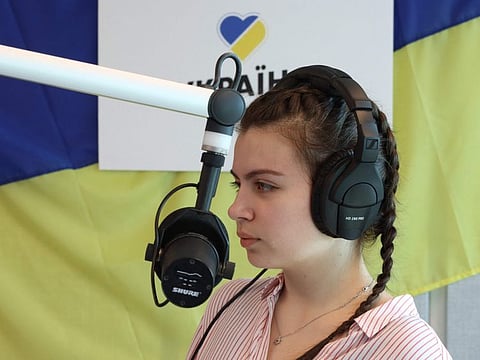 Sofia Tatomyr of "Radio Ukrajina" talks to listeners, largely Ukrainian war refugees at the radio headquarters of Radio Ukrajina in Prague.