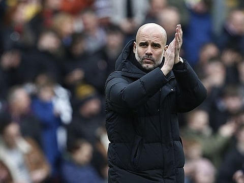 Manchester City manager Pep Guardiola applauds fans after the match against Burnley. City won 2-0.