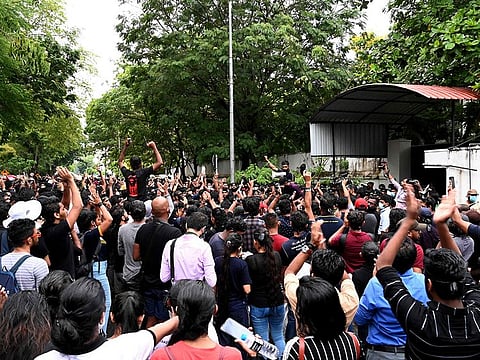 Demonstrators take part in a protest at the entrance of the Sri Lanka prime minister Mahinda Rajapaksa's residence in Colombo on April 5, 2022.