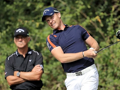 Peter Cowen (left) keeps an eye on his ward Danny Willett's swing. Willett, along with Brooks Koepka, Padraig Harrington and Matt Fitzpatrick are the four of Cowen's players who will be in action this week at the Augusta.