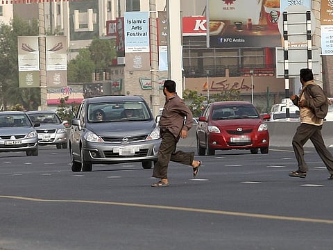 File picture of jaywalkers crossing Al Ittihad Road in Sharjah