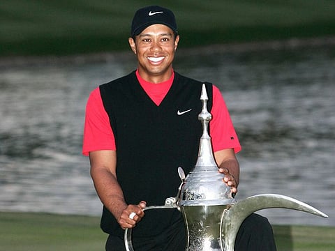 2008: Tiger Woods poses with the Dubai Desert Classic golf trophy at the Emirates Golf Club in Dubai.
