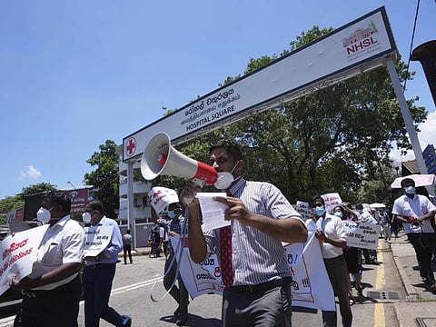 Sri Lankan government doctors sprotest against the government near the national hospital in Colombo, Sri Lanka, Wednesday, April 6, 2022.