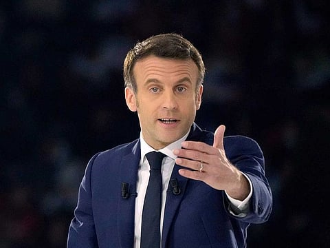 French President Emmanuel Macron and centrist candidate for reelection delivers his speech during a meeting in Paris, Saturday, April 2, 2022.