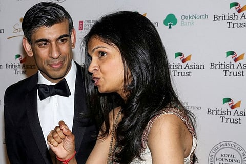 British Chancellor of the Exchequer Rishi Sunak and his wife Akshata Murthy attend a reception to celebrate the British Asian Trust, at The British Museum, in London on February 9, 2022. Sunak on Thursday faced awkward questions about his wife's finances after she confirmed she did not pay UK taxes on her foreign earnings on the same day he hiked taxes for millions of people.