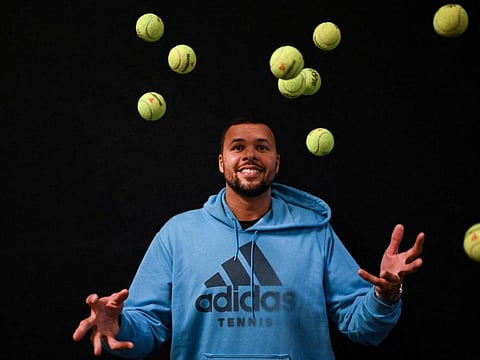 Jo-Wilfried Tsonga juggles with tennis balls earlier this year. The Frenchman will be calling it quits after this year's French Open.