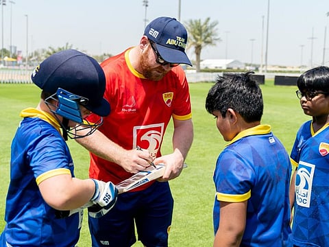 Ireland all-rounder Paul Stirling sighs autographs to budding players of the Zayed Cricket Academy in Abu Dhabi.
