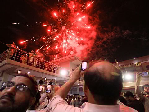 Supporters of the Pakistan Muslim League-Nawaz (PML-N) celebrate after Shehbaz Sharif was sworn in as the country's prime minister, in Peshawar, Pakistan April 11, 2022.