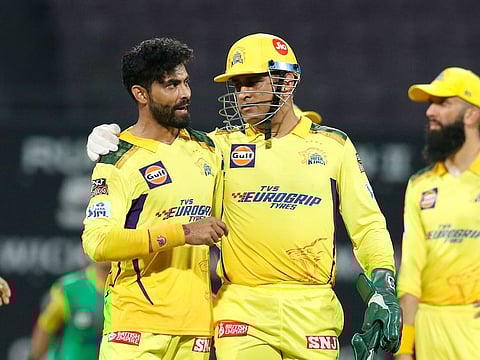 Captain Ravindra Jadeja and MS Dhoni of the Chennai Super Kings during the match against the Royal Challengers Bangalore in the Tata Indian Premier League 2022 at the DY Patil Stadium in Mumbai on April 12, 2022 .
