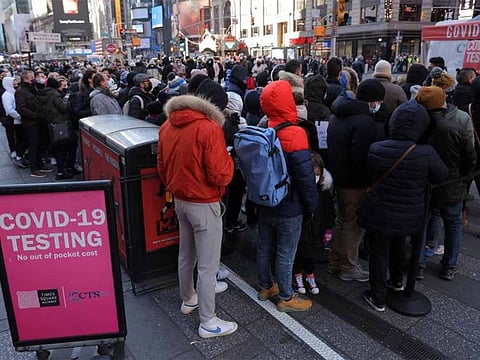 The increases in US Social Security COLA payments will take effect at the end of December. Though the new amounts are effective for 2023, the first Social Security payment of each year is technically due Jan. 1, which is a federal holiday. File photo shows people queueing for a COVID-19 test in Times Square in Manhattan, New York City