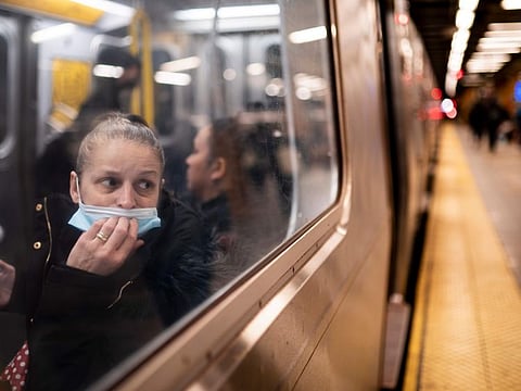 A passenger looks out onto the platform while riding a northbound train in 36th Street subway station where a shooting attack occurred the previous day during the morning commute, Wednesday, April 13, 2022, in New York.