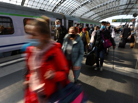 Refugees from Ukraine walk on a platform after they left a train from Warsaw, Poland, at Berlin's Hauptbahnhof central station, amid Russia's attack on Ukraine, in Berlin, Germany March 29, 2022.