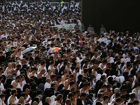 Muslims pray around the Kaaba, Islam's holiest shrine, at the Grand Mosque complex in the Saudi city of Mecca, on April 9, 2022.