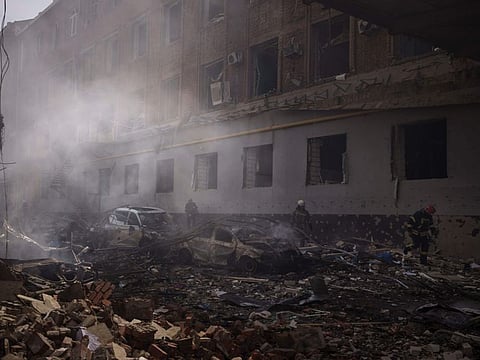 Firefighters work to extinguish multiple fire after a Russian attack in Kharkiv, on April 16, 2022.
