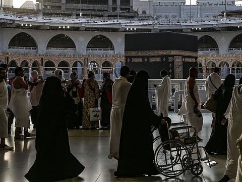 The faithful gather for prayer around the Kaaba at the Grand Mosque complex in Mecca on April 9, 2022.