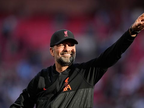 Liverpool's manager Jurgen Klopp applauds fans at the end of the English FA Cup semifinal match against Manchester City at Wembley stadium in London. Liverpool won 3-2 to keep their hopes of the quadruple alive.