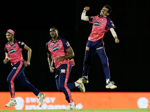 Yuzvendra Chahal (right) celebrates his hat-trick during the five-wicket haul against KKR.