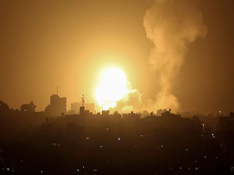 An explosion is caused by Israeli airstrikes on a Hamas military base in town of Khan Younis, southern Gaza Strip, Tuesday April 19, 2022.