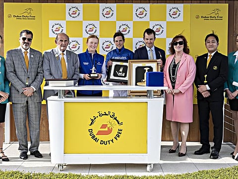 Alex Merriam, James Doyle and groom receive their trophies after Walk Of Stars won the DDF Golf World Cup from Colm McLoughlin, Salah Tahlak and Sinead El Sibai at Newbury Racecourse on Sunday.