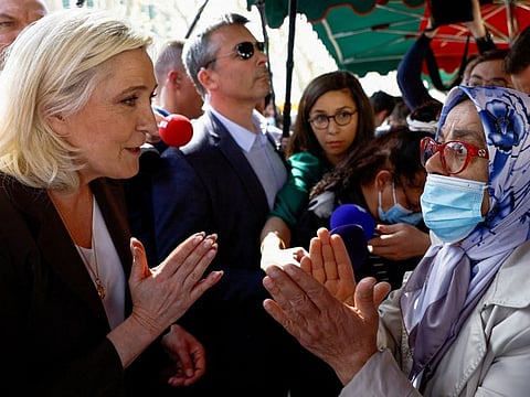 Marine Le Pen, French far-right National Rally (Rassemblement National) party candidate in the 2022 French presidential election, visits a market as she campaigns in Pertuis, near Marseille in the south of France, April 15, 2022.