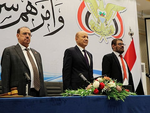 The head of Yemen's new Presidential Council Rashad Al-Alimi stands during a session of the Yemeni parliament during which he and members of the Presidential Council took the oath in Aden, Yemen April 19, 2022.
