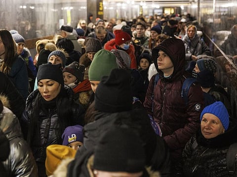 Displaced Ukrainians make their way to a platform at Lviv-Holovnyi railway station in Lviv, Ukraine, on March 14, 2022.