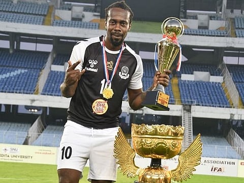 Mohammedan Sporting Club's Marcus Joseph with the 2021 Calcutta Football League Trophy. The team is currently 2nd in the I-League and with just 6 games left and 4 points from top Joseph says they can win the title.