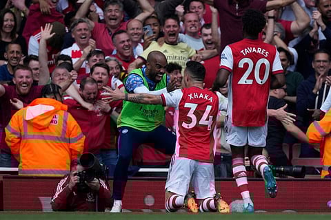 Arsenal's Granit Xhaka celebrates after scoring his side's third goal during the English Premier League match against Manchester United at the Emirates stadium in London.