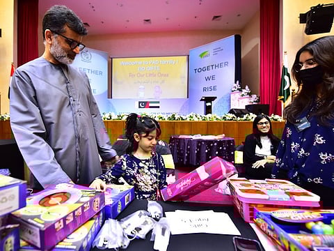 Little Anabiya Fancy chooses her gift at the Pakistan Association Dubai on Saturday.