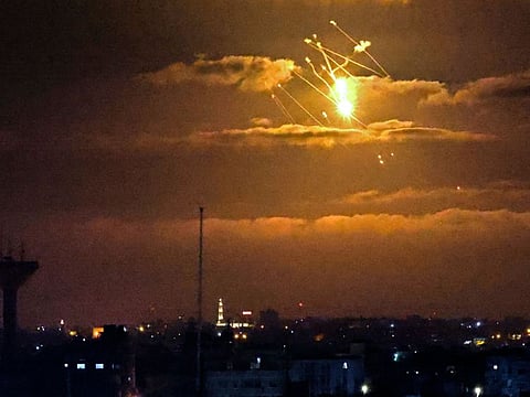 Israeli Iron Dome missiles intercept incoming missiles fired from the Gaza Strip above the Palestinian enclave, on April 21, 2022.
