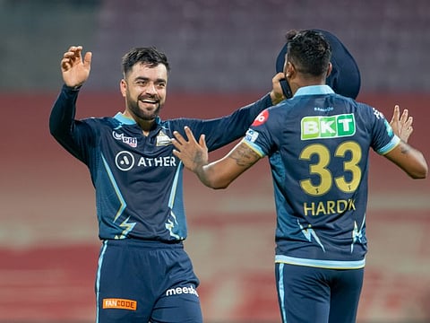 Rashid Khan and Hardik Pandya captain of Gujarat Titans celebrate after beating Kolkata.
