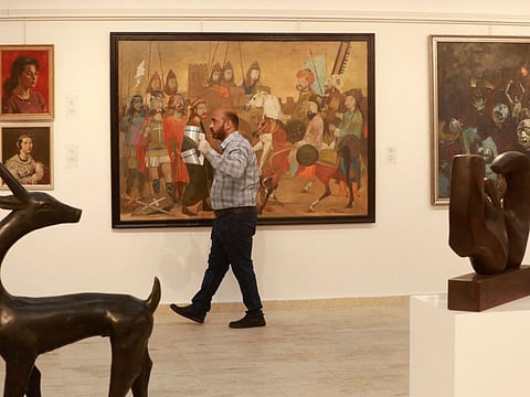 Restored art pieces by renowned Iraqi artists are on display at Iraq's Ministry of Culture in Baghdad on April 6, 2022.