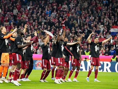 Bayern players celebrate winning the title at the end of the German Bundesliga match against Borussia Dortmund, at the Allianz Arena, in Munich, Germany.