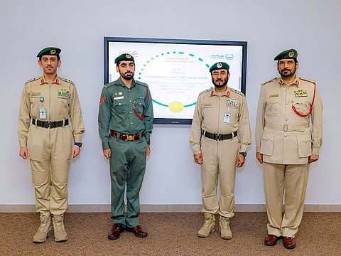 Muhammad Abdulwahed Hasan Muhammad with other Dubai Police officials.