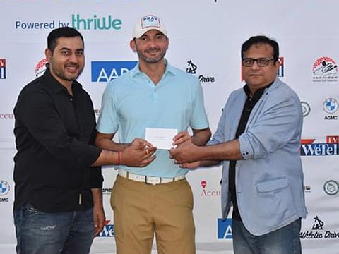 Miki Mirza (centre) winner of Division 1 in the recent Dubai Creek Golf and Yacht Club Emirates NBD Race to Malaysia Qualifier.
