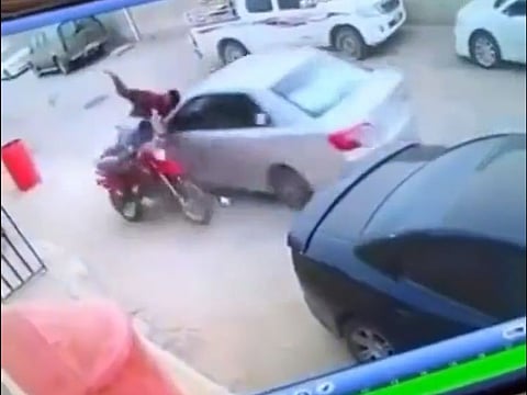 The pre-iftar incident was captured by a video posted on social media, showing the car hitting both men who were standing next to a motorcycle and speeding off, according to online portal Al Marsd.