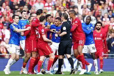 Boiling over... Everton and Liverpool players tussle during the English Premier League match at Anfield stadium in Liverpool, England.