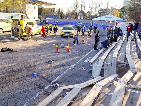 Emergency services work at a scene where a car drove into a grandstand during a motorshow, at Bjerkebanen in Oslo, Norway
