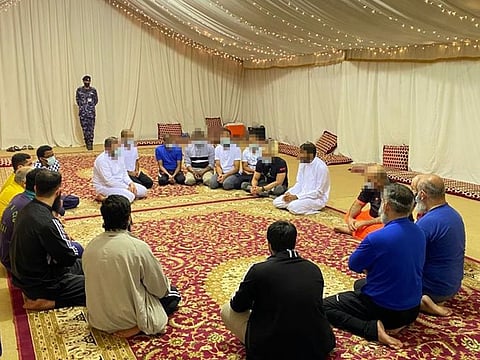 Inmates socialising inside their Ramadan tent