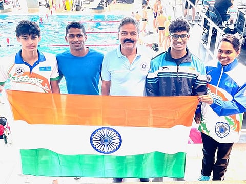 Team India pose with the tricolour at the Danish Open. From left: Vedaant Madhavan, Olympian Sajan Prakash, coach Pradeep Kumar, Tanish George Matthew and Shakti Balakrishnan.