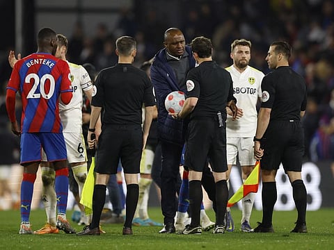 Crystal Palace manager Patrick Vieira with referee Darren England after the English Premier League match against Leeds United at Selhurst Park on Monday.