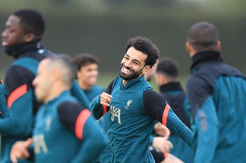 Liverpool's Egyptian midfielder Mohamed Salah (centre) attends a team training session at Anfield Stadium in Liverpool on Monday, on the eve of their Uefa Champions League semi-final first leg against Villarreal.