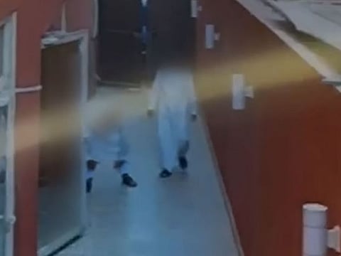 The footage shows the three walking barefoot into the house and later leaving with pairs of shoes apparently after failing to lay hands on pricier items.