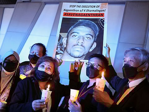 People take part in a vigil ahead of the planned execution of Malaysian drug trafficker Nagaenthran Dharmalingam, outside Singapore High Commission in Kuala Lumpur, Malaysia, April 26, 2022.