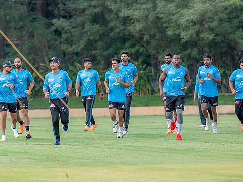 Ricky Ponting, head coach of Delhi Capitals (third left), warms up with his players in Mumbai.