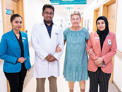 Larisa Strotskaia (third from left) walked the same day after ER surgery for total bilateral knee replacement. She is seen here with Dr Rahgavendra Sidappa and other members of Aster Hospital, Al Qusais.